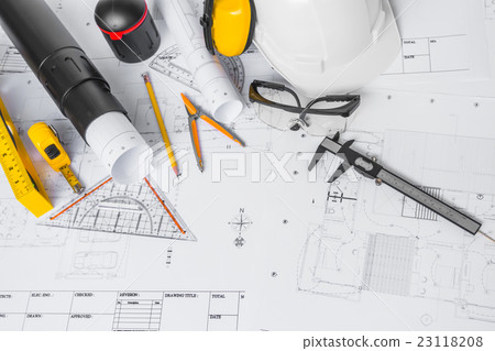 Construction plans with White helmet and drawing tools on blueprints . Construction plans with White helmet and drawing tools on blueprints . 23118208