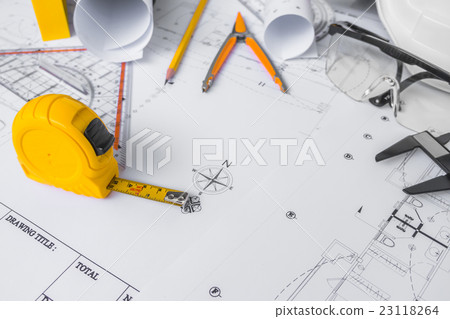 Construction plans with White helmet and drawing tools on blueprints . 23118264