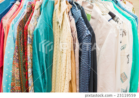 clothes hanging on a rack in a flea market clothes hanging on a rack in a flea market 23119559