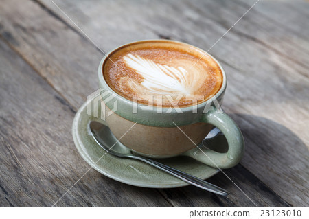 Close-up cup of latte coffee on wooden  23123010
