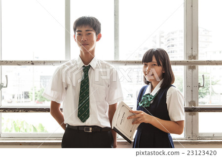 Male and female students on the window at rest time 23123420