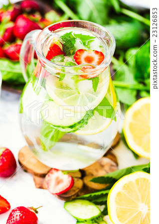 Water with lemon, mint and cucumber in glass Water with lemon, mint and cucumber in glass 23126853