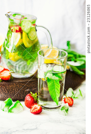 Water with lemon, mint and cucumber in glass Water with lemon, mint and cucumber in glass 23126865