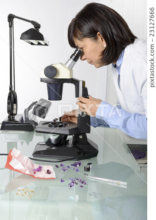 Woman appraiser gems in laboratory Woman appraiser gems in laboratory 23127666