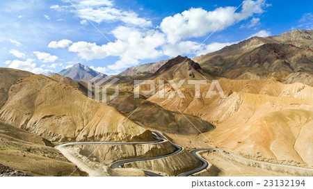 The new winding road in the Himalayas mountains The new winding road in the Himalayas mountains 23132194