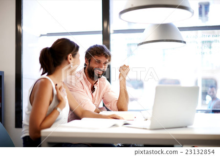 Businesspeople looking together at computer Businesspeople looking together at computer 23132854