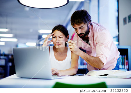 Students talking together over computer Students talking together over computer 23132860