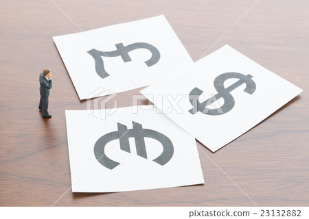 A businessman who thinks about currency exchange 23132882