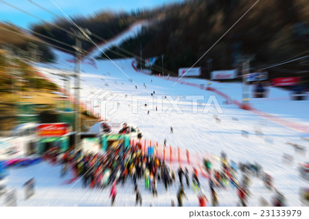 Blurred of the skier is skiing on the snow. 23133979