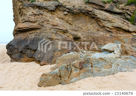 Rock on sandy beach. Rock on sandy beach. 23140679