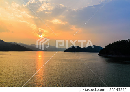 Sunset over a mountain at lake Sunset over a mountain at lake 23145211