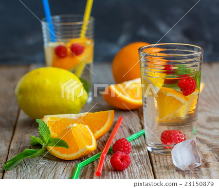 Glass of lemonade with fruit. Glass of lemonade with fruit. 23150879