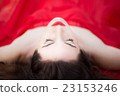 Lady in Red Dress Laying Down Eyes Closed  23153246