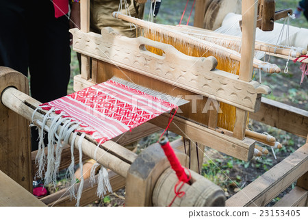 part of the fabric woven in a loom part of the fabric woven in a loom 23153405