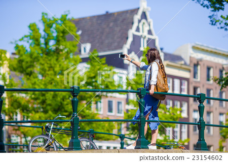 Young woman tourist taking self portrait selfie Young woman tourist taking self portrait selfie 23154602