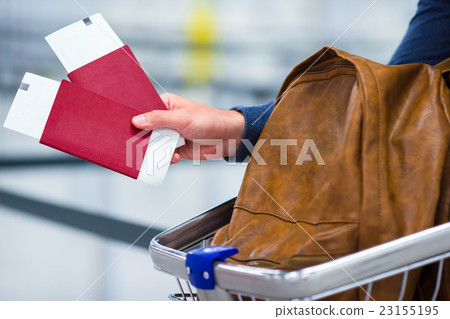 Closeup of passport and boarding ticket and a Closeup of passport and boarding ticket and a 23155195