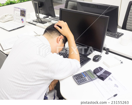 A businessman troubled with holding his head 23155263