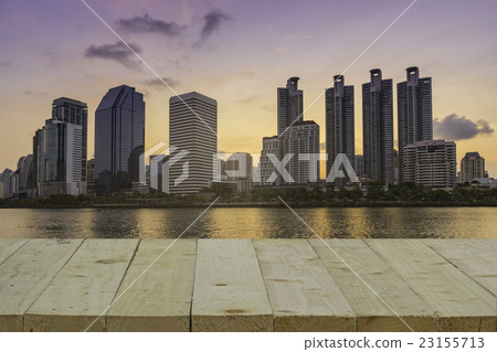wood table top on blur of cityscape in the park  23155713