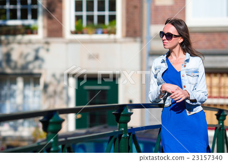 Young woman enjoy european vacation in Amsterdam Young woman enjoy european vacation in Amsterdam 23157340