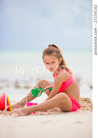 Adorable little girl playing with toys during Adorable little girl playing with toys during 23159182