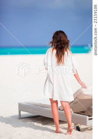 Young beautiful woman on beach vacation Young beautiful woman on beach vacation 23159186