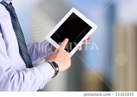 Businessman holding a digital tablet 23161035