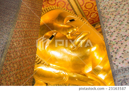 Close up Reclining Buddha gold statue 23163587