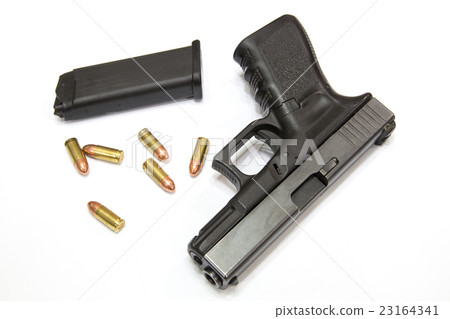 Closeup Bullets and Gun on white background 23164341