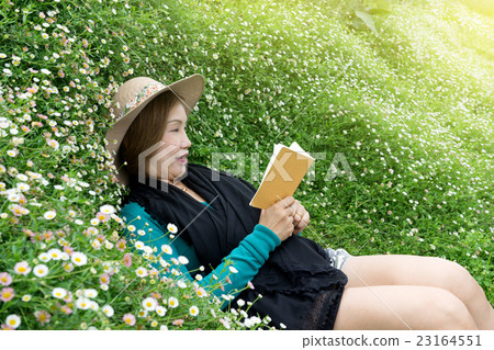 woman lay down flower garden woman lay down flower garden 23164551