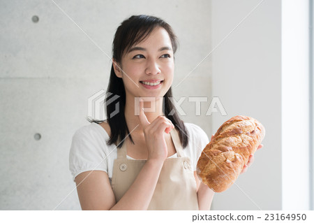 A woman with bread 23164950
