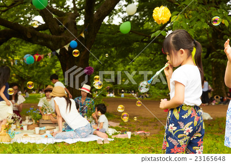 Children playing with soap bubbles Children playing with soap bubbles 23165648