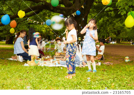 Children playing with soap bubbles Children playing with soap bubbles 23165705