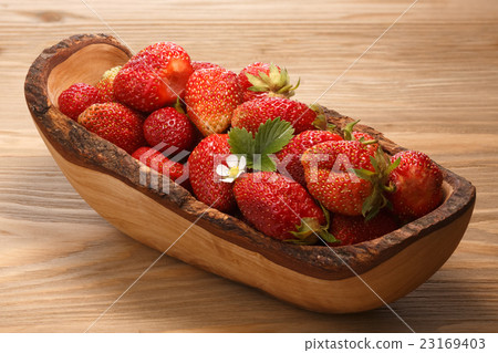 Wooden bowl of fresh strawberries Wooden bowl of fresh strawberries 23169403