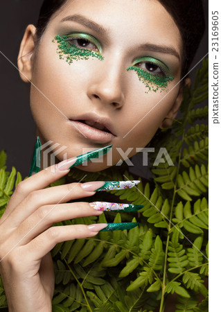 Beautiful girl with art make-up, fern leaves and 23169605