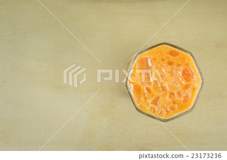 iced milk tea on wood background. iced milk tea on wood background. 23173236