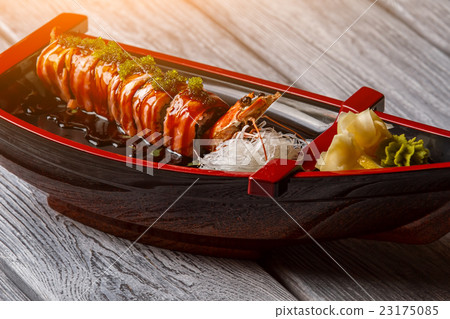 Sushi boat on wooden background. 23175085