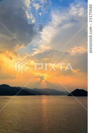 Sunset over a mountain at lake Sunset over a mountain at lake 23175680