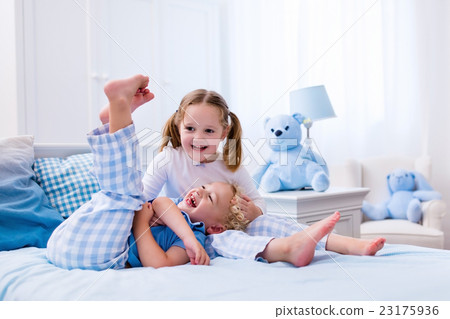 Kids playing in white bedroom Kids playing in white bedroom 23175936
