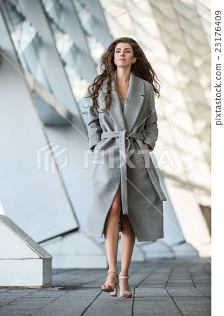 Pretty girl walks outdoors 23176409
