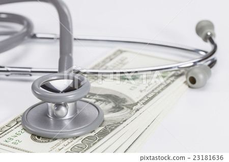 Stethoscope on a pile of money, depicting health 23181636