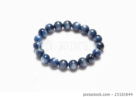 Lucky stone bracelet on white background. 23181644