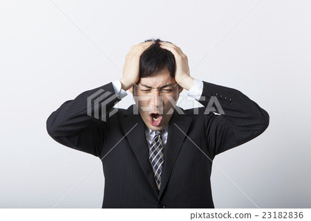 A businessman shouting with his head A businessman shouting with his head 23182836