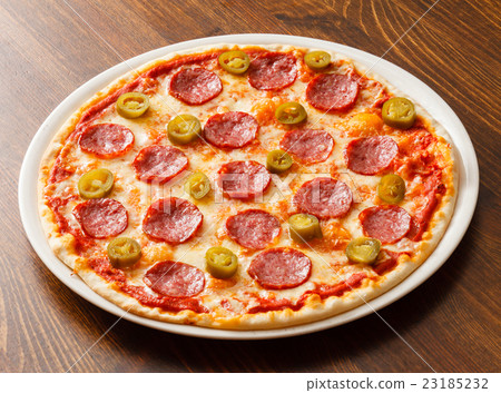 pizza on wood background 23185232