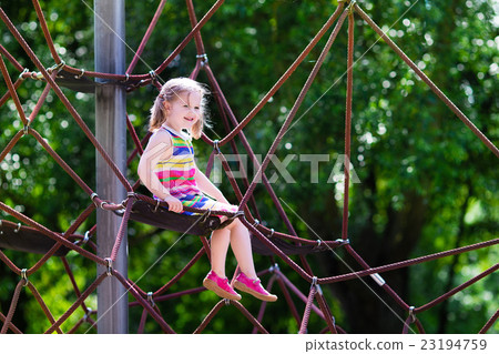 Child having fun on school yard playground 23194759
