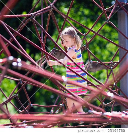 Child having fun on school yard playground 23194760