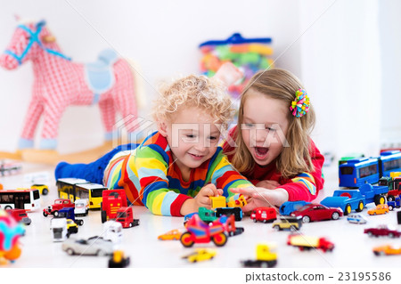 Little kids playing with toy cars Little kids playing with toy cars 23195586