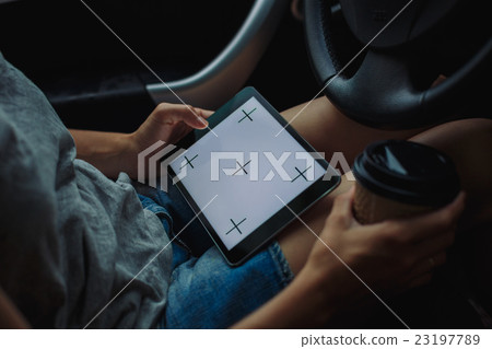 woman with tablet in the car woman with tablet in the car 23197789