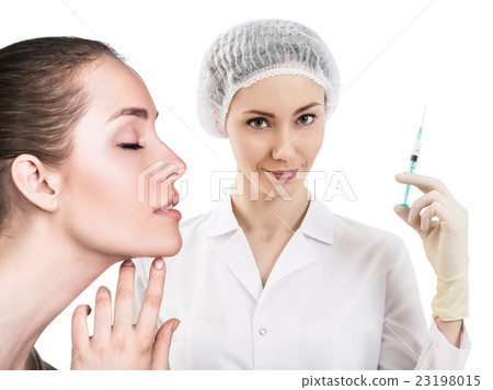 Beautiful woman face near doctor with syringe 23198015