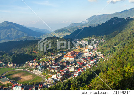 Buildings nestled in the green valley of Sapa 23199215