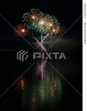 Colorful fireworks with reflection on lake. 23205184
